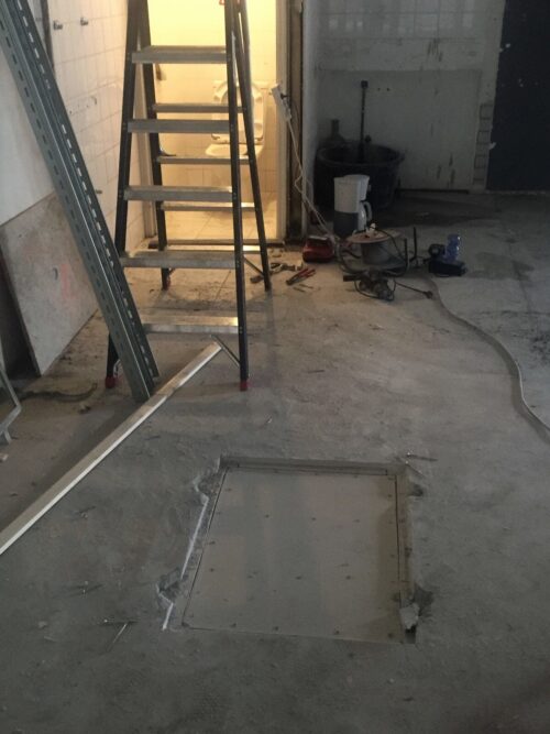 Microcement vloer bij nieuw filiaal Open32