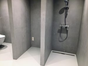 Lees meer over het artikel Microcement wanden showroom Amsterdam