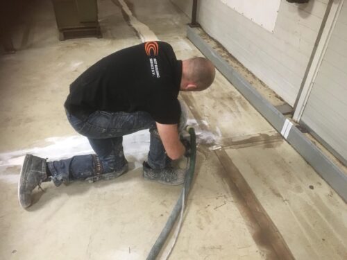 Full epoxy rolcoating over stelconplaten in bedrijfshal Ede